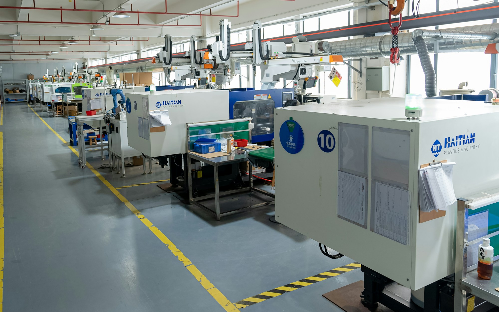 Injection molding machines operating in a Chinese manufacturing facility